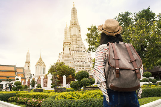 Asian women backpacker  travel Wat Arun temple, Relax time on vacation hipster lifestyle