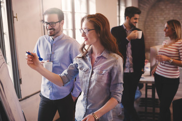 Group of creative designers and office coworkers working on project