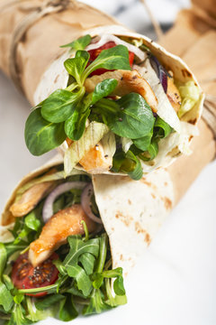 Fresh tortilla wraps with vegetables and chicken. Gourmet conception.