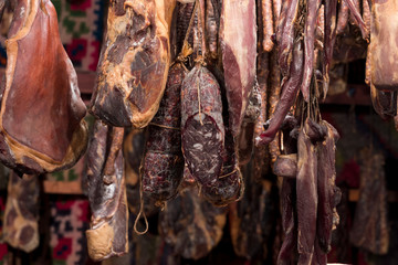 Romanian traditional meat products, by smoked pork hanging in smokehouse