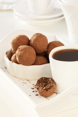 Homemade vegan chocolate truffles. White background. Selective focus. Vertical. Toned photo.