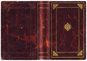 Antique open book with purple leather cover and embossed golden decorations