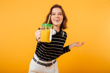 Portrait of a happy showing cocktail
