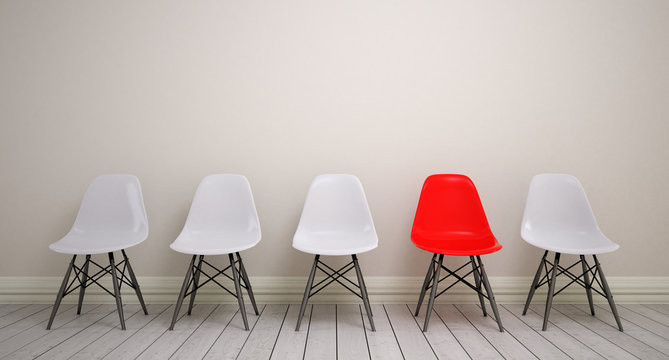 Wartezimmer mit Schalensitz-Stuhlreihe mit weißen und schwarzen Stühlen