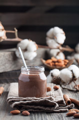 Homemade chocolate pudding with cocoa,  carob, cinnamond and almond milk in jar
