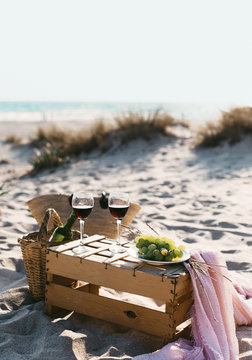 Wine and grape on beach