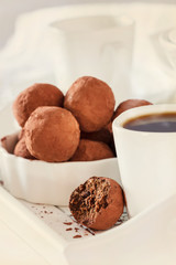 Homemade chocolate vegan truffles. White background. Selective focus. Toned photo.