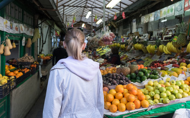 Undefined tourist girl at Porto market (Mercado do Bolhao). Portugal