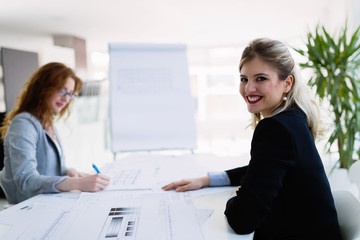 Fototapeta premium Portrait of young architect woman on meeting