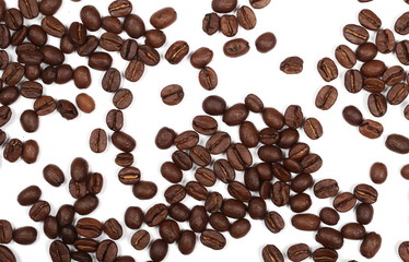 Coffee beans pile isolated on white background and texture, top view
