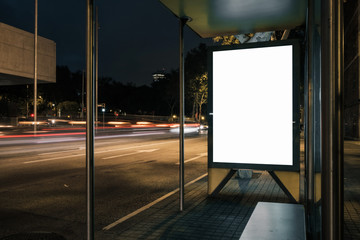 Advertisement light box mock-up at a bus stop at night. Marketing design.