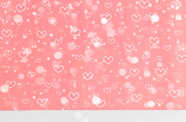 Heart shape and snowfall on sweet pink wood background with copy space. Raster pattern for Christmas or new year and love theme on Valentine's day concept can apply for product display and other.
