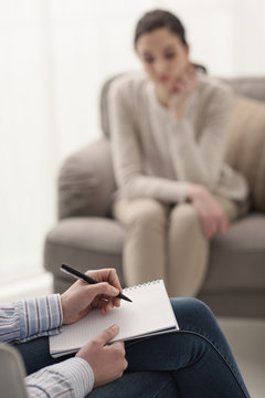 Psychologist listening to her patient