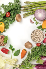 Vibrant fresh vegetables, cereals, and mushrooms on white background with copyspace