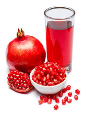 Pomegranate juice and fruit in ceramic bowl close-up