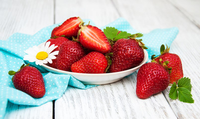 ripe strawberries on wooden table