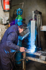 Professional welder in working process