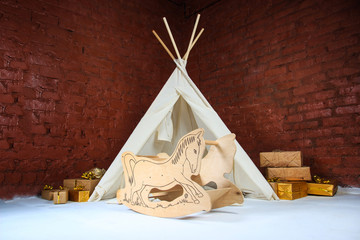 Small tepee in a kids  interior. wigwam in the studio © dyageleva