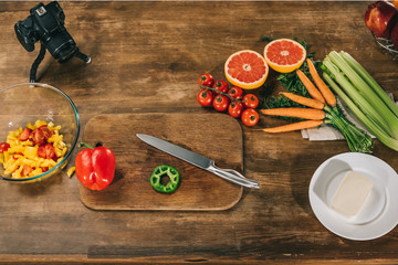 overhead view of vegetables and fruits on wooden table
