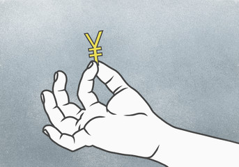 Cropped hand of man holding Yuan symbol against gray background