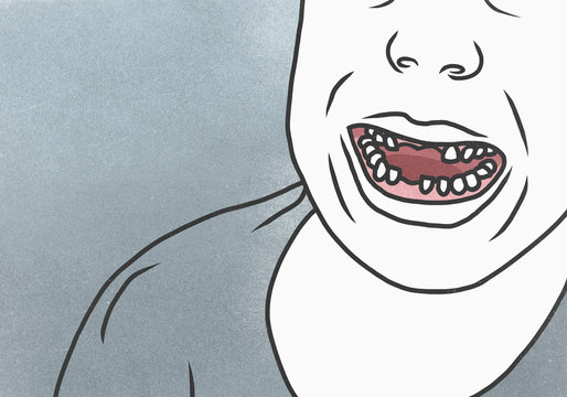 Cropped image of man with gap toothed against gray background