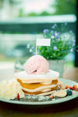 fruit pancake with strawberry icecream ready to eat on wood table