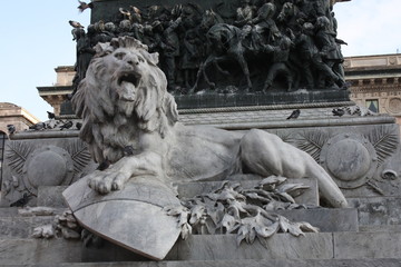 Sculpture of a lion as part of the monument to Victor Emanuel II in the Piazza del Duomo in Milan,...