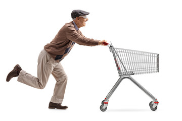 Senior with 3D glasses running and pushing an empty shopping cart