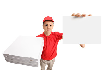 Teenage pizza delivery boy with a stack of pizza boxes and a blank card © Ljupco Smokovski