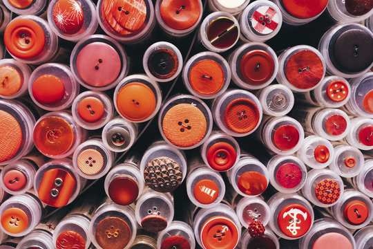 Full frame shot of various buttons on plastic containers