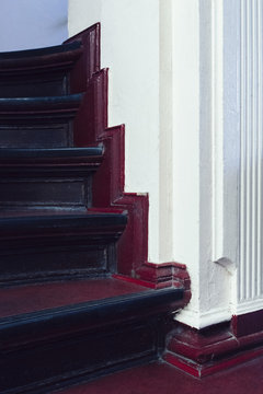 Stairway and maroon baseboard of house
