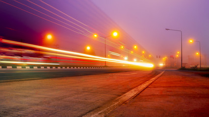 Fototapeta na wymiar highway bridge at night with traces of light traffic