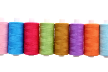 A colorful spool with threads often used in tailoring and is an indispensable element of this profession.
