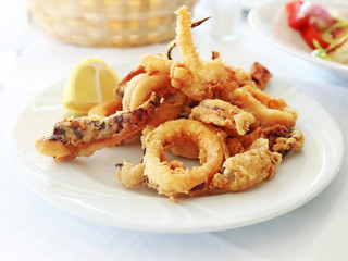 plate with squid at a greek tavern - mediterranean seafood