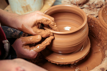 Potter at work. Workshop place.