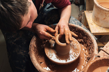 Potter at work. Workshop place.