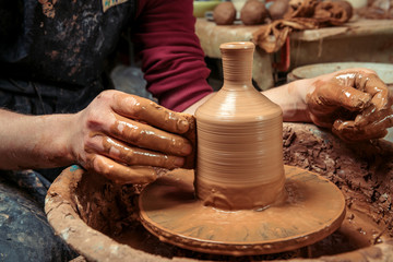 Potter at work. Workshop place.