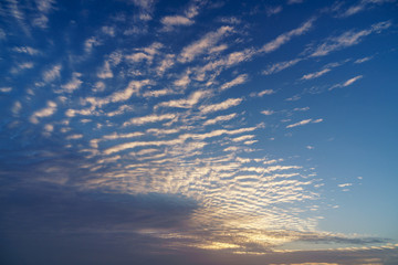 Beautiful landscape view on morning yellow sky and sunrise with clouds.