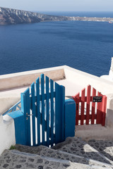 Two different colorful gates in Oia, Santorini