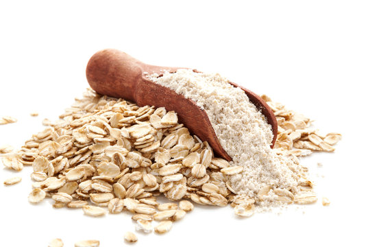 Pile of oat wholegrain flour in spoon
