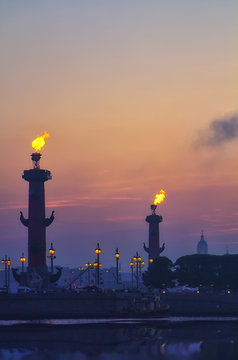 Classic view of Saint-Petersburg ( St.Petersburg ) river scape at sunset. Spit of Vasilyevsky Island. Neva River. Rastral columns with fires