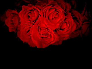 Bouquet of  red roses on a black background