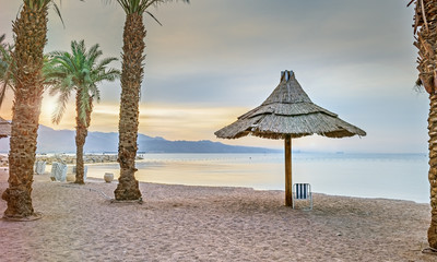 Morning and relaxing atmosphere at the central public beach in Eilat - famous resort city in Israel