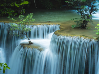 Great and beautiful waterfall in the green forest of Thailand