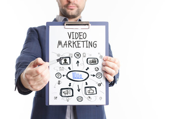 The concept of business, technology, the Internet and the network. A young businessman shows a successful scheme of work: Video marketing