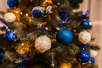 Fototapeta na wymiar Christmas pine branch with decorations and balls