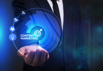 Business, Technology, Internet and network concept. Young businessman working on a virtual screen of the future and sees the inscription: Content marketing