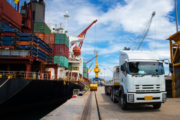 delivery and transit cargo units of container from yard to the ship vessel loading in port terminal by trucking of lorry, the logistics system services to global worldwide transportation CONCEPT - obrazy, fototapety, plakaty