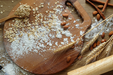 Cake making equipment. wooden rolling pin and Various wooden on brown table.