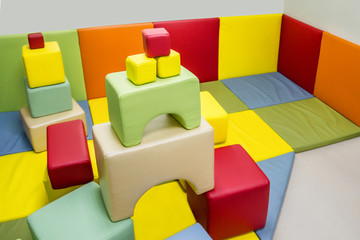 Indoor kids playground with colorful soft blocks